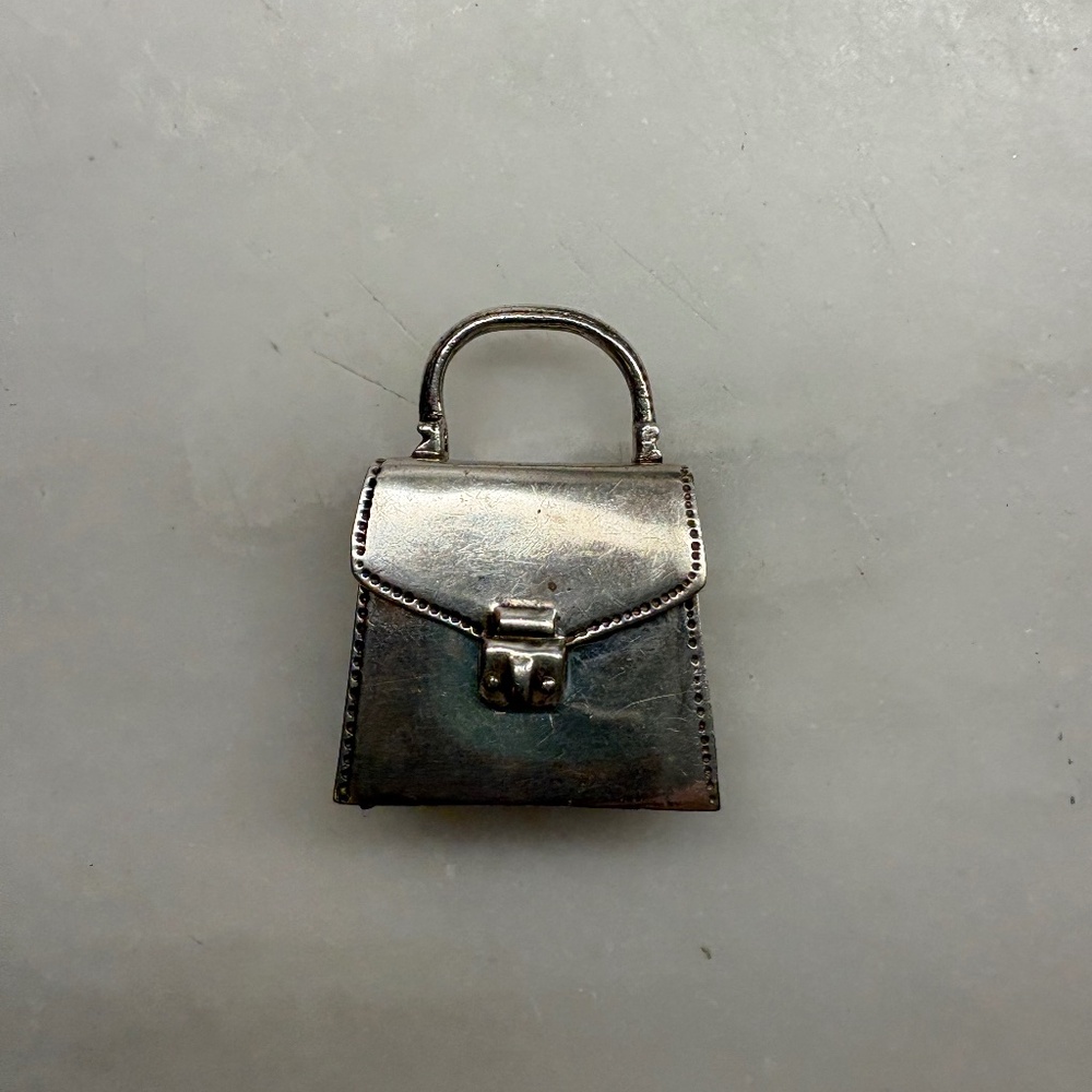 Lovely Tiffany & Co. Solid Silver Pillbox in the shape of a handbag.